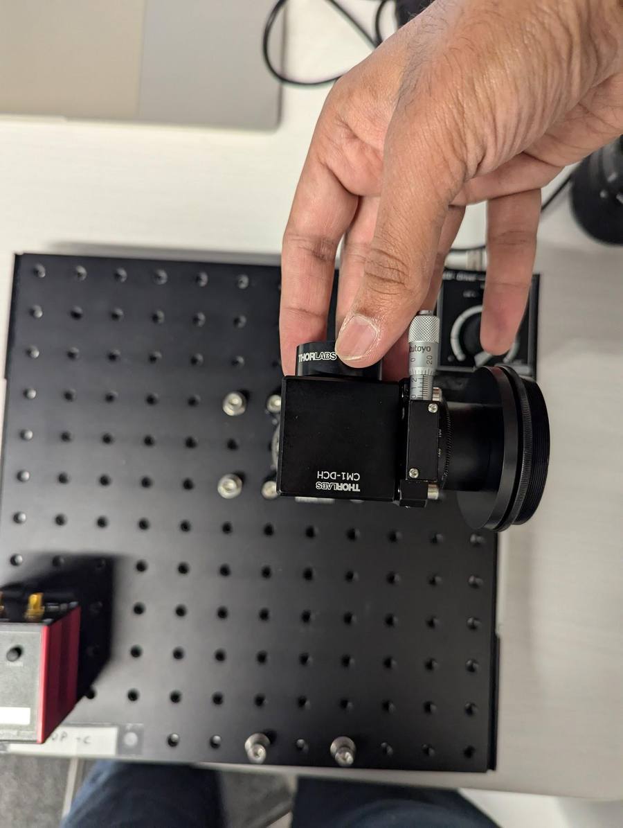 Screwing the lens onto the cage cube