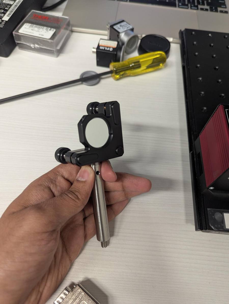 Round mirror mount in hand